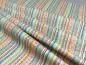 Preview: Patchwork Stoff mit bunten, gemusterten Streifen aus der Serie Doodle Days von Makower Faltenwurf